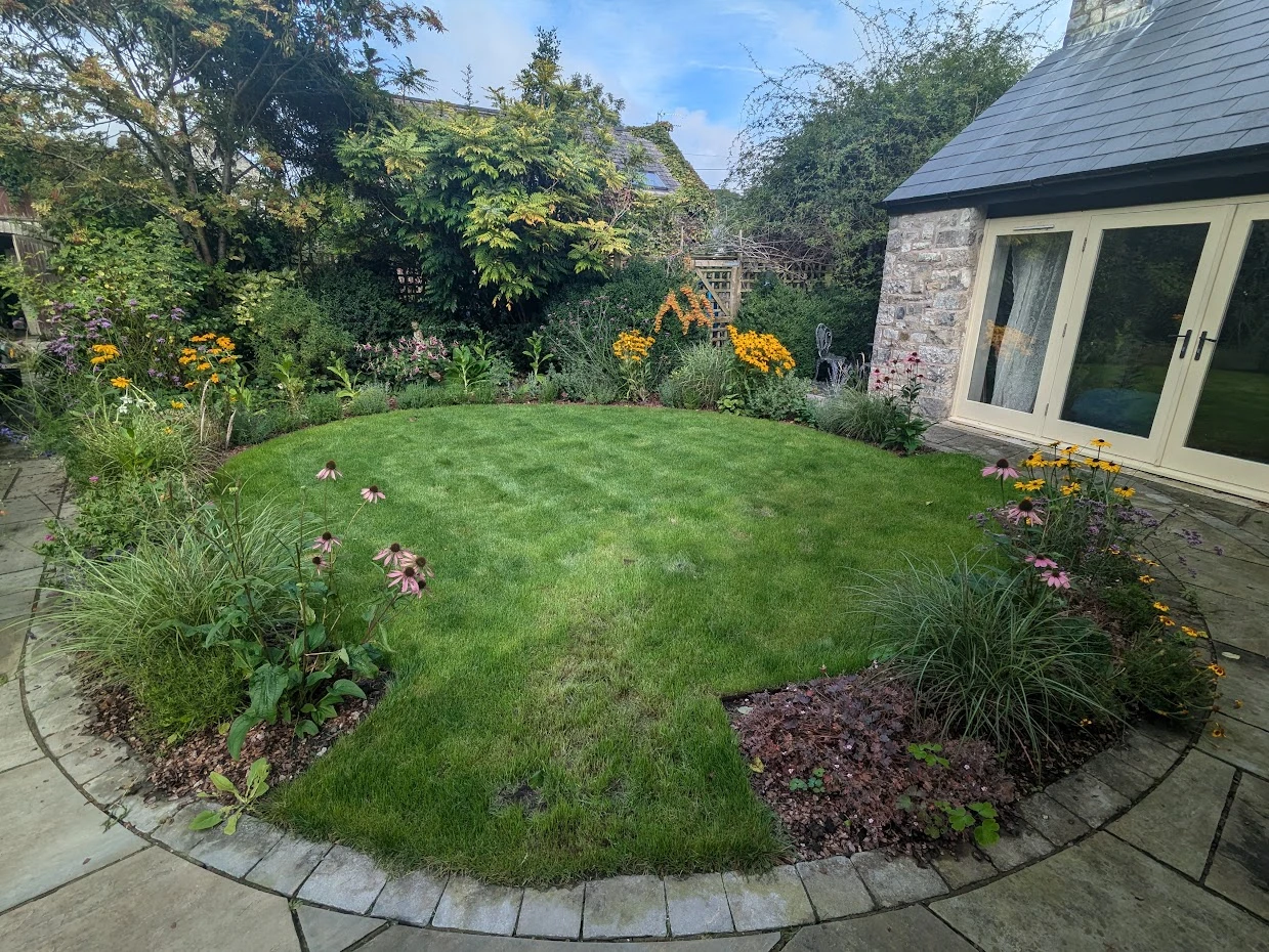 Rear Lawned Garden of a Stone House in South Wales